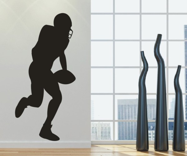 Wandtattoo Sportschatten | Ein American Footballspieler läuft mit Football in der Hand als Silhouette günstig kaufen