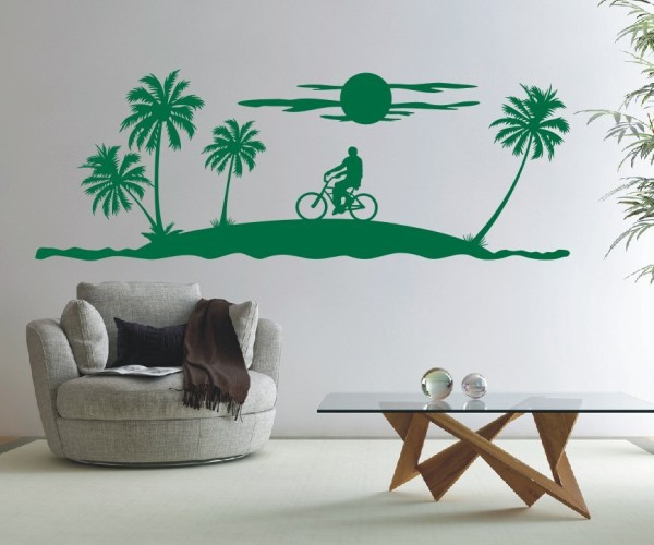 Landschaft Wandtattoo | Eine tropische Insel mit einem Fahrradfahrer unter Palmen und der Sonne | ✔Made in Germany  ✔Kostenloser Versand DE