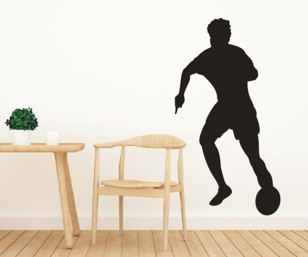 Wandtattoo Sportschatten | Ein Fußballspieler mit einem Fußball als Silhouette günstig kaufen